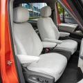 massgefertigte-sitzbezuege-geeignet-fuer-vw-t7-multivan-ab-2021-2-sitzer-1-reihe-len-beige-gewebe-mit-klassischer-webstruktur-rueckenlehne-mit-oeffnung-fuer-den-klapptisch.webp