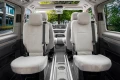 massgefertigte-sitzbezuege-geeignet-fuer-vw-t7-multivan-ab-2021-1-sitzer-2-3reihe-len-beige-gewebe-mit-klassischer-webstruktur-rueckenlehne-mit-oeffnung-fuer-den-klapptisch.webp